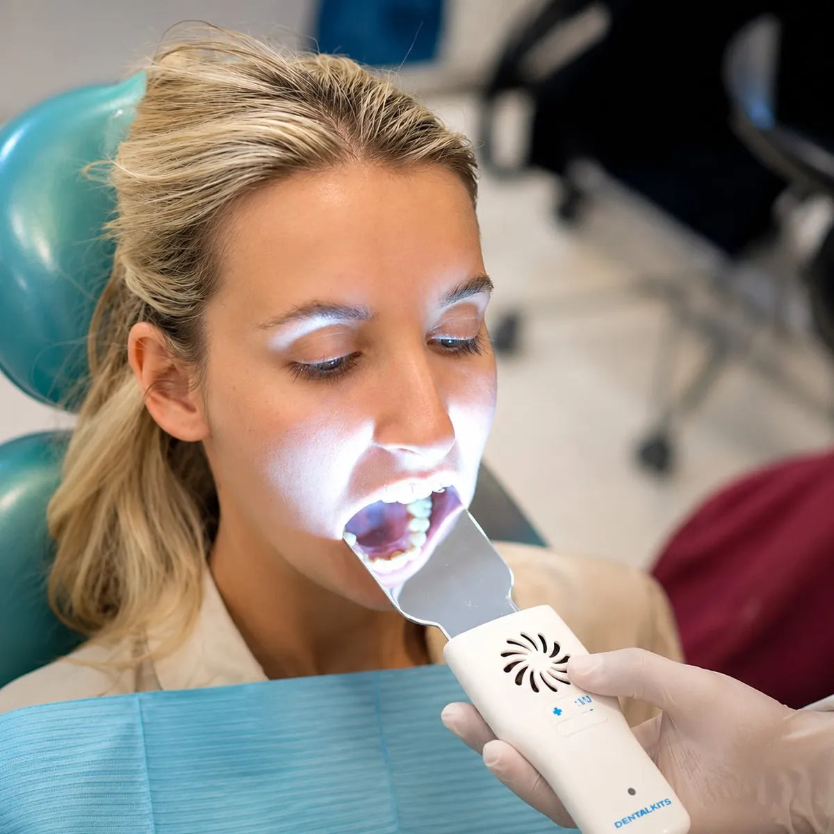 Anti-fog mirror reflecting upper teeth during buccal intraoral photography.