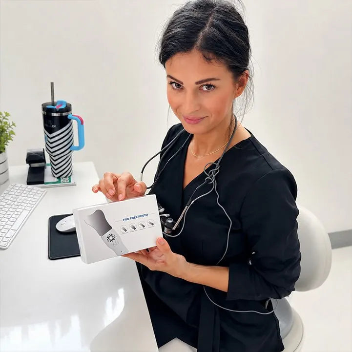 Dentist unboxing the Anti-Fog Mirror System at her desk.