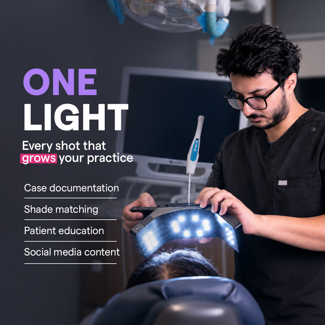 Dentist holding Dental Photography Light for case documentation