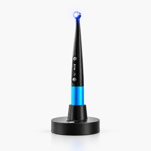 Dental curing light with caries detection on wireless charging base