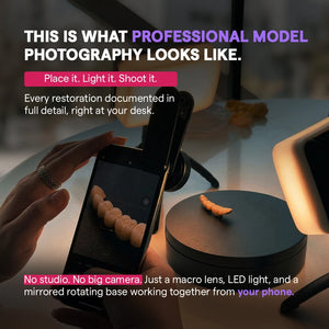 Smartphone with macro lens photographing restorations on a rotating base.