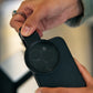 CPL filter being clipped onto smartphone camera for dental photography.