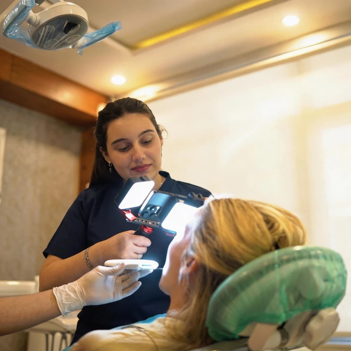 Dentist taking intraoral photo with Twin Light
