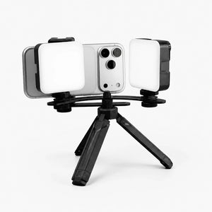 Dental twin light with tripod and smartphone for photography.