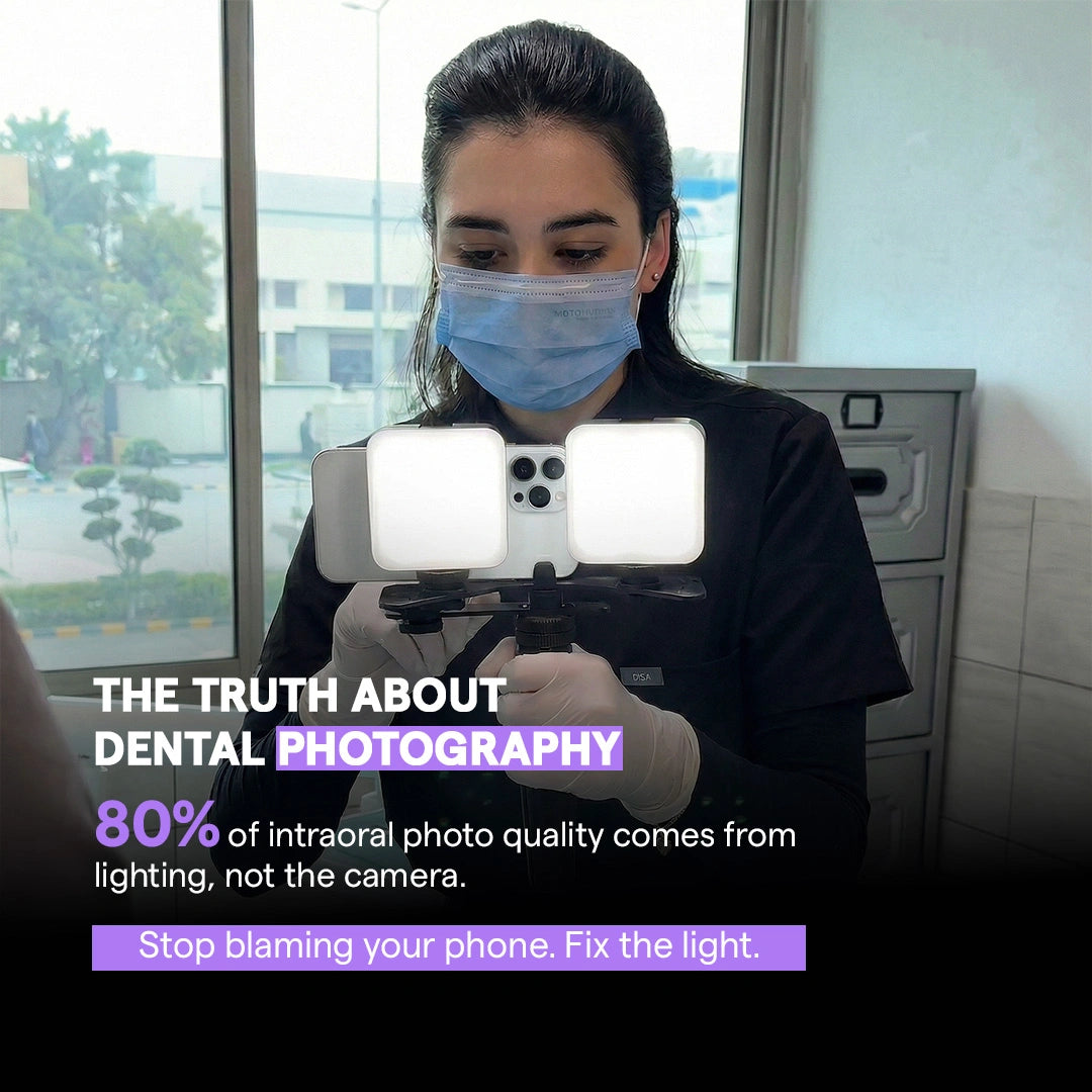 Dentist holding dual LED lights with smartphone in a clinic.